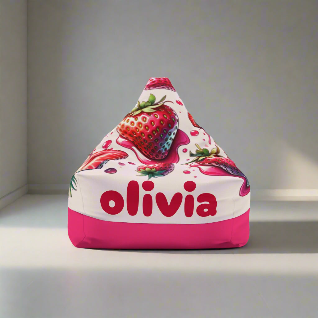 A triangular bean bag chair cover with a strawberry design and the name 'olivia' printed on it.