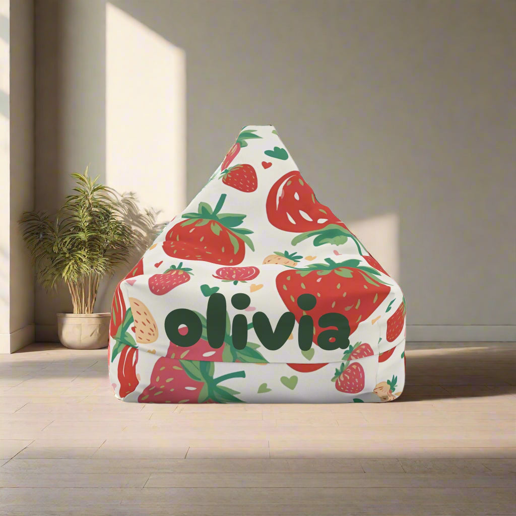 A bean bag chair cover with an all-over print of strawberries and the name 'olivia' printed on the front.