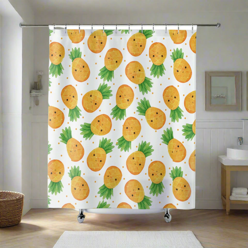 A shower curtain featuring a cute pineapple theme with colorful pineapple designs on a white background, displayed in a bathroom setting.