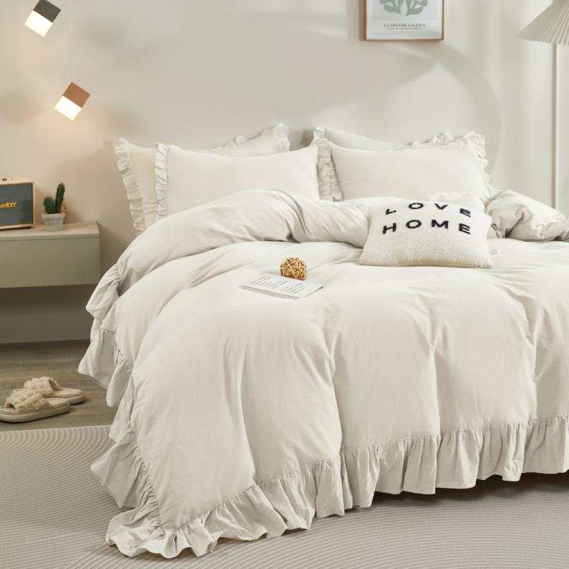 White rustic farmhouse bed with soft ruffle duvet cover and matching pillows in cozy bedroom setting