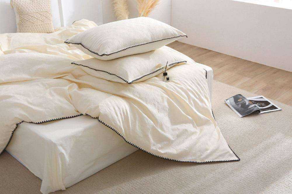 French Vintage Cream White Duvet Cover Set on bed with pillowcases, elegant bedroom decor.