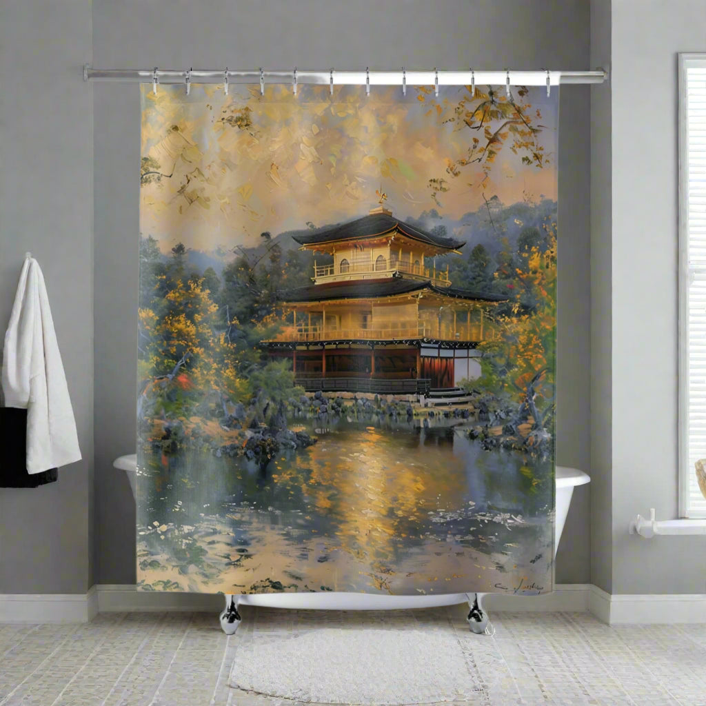 A shower curtain featuring a printed image of an ancient gold temple in Kyoto, Japan, set against a bathroom backdrop with black tiles.