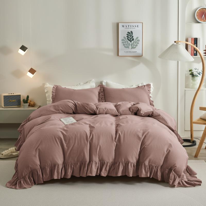 Rose Rustic Farmhouse ruffled duvet cover in dark grey, adding elegance to a bedroom with its soft cotton fabric and ruffle trim.