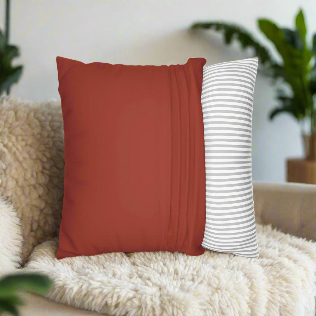 Red pillow with 'Merry & Married' text on a gray couch
