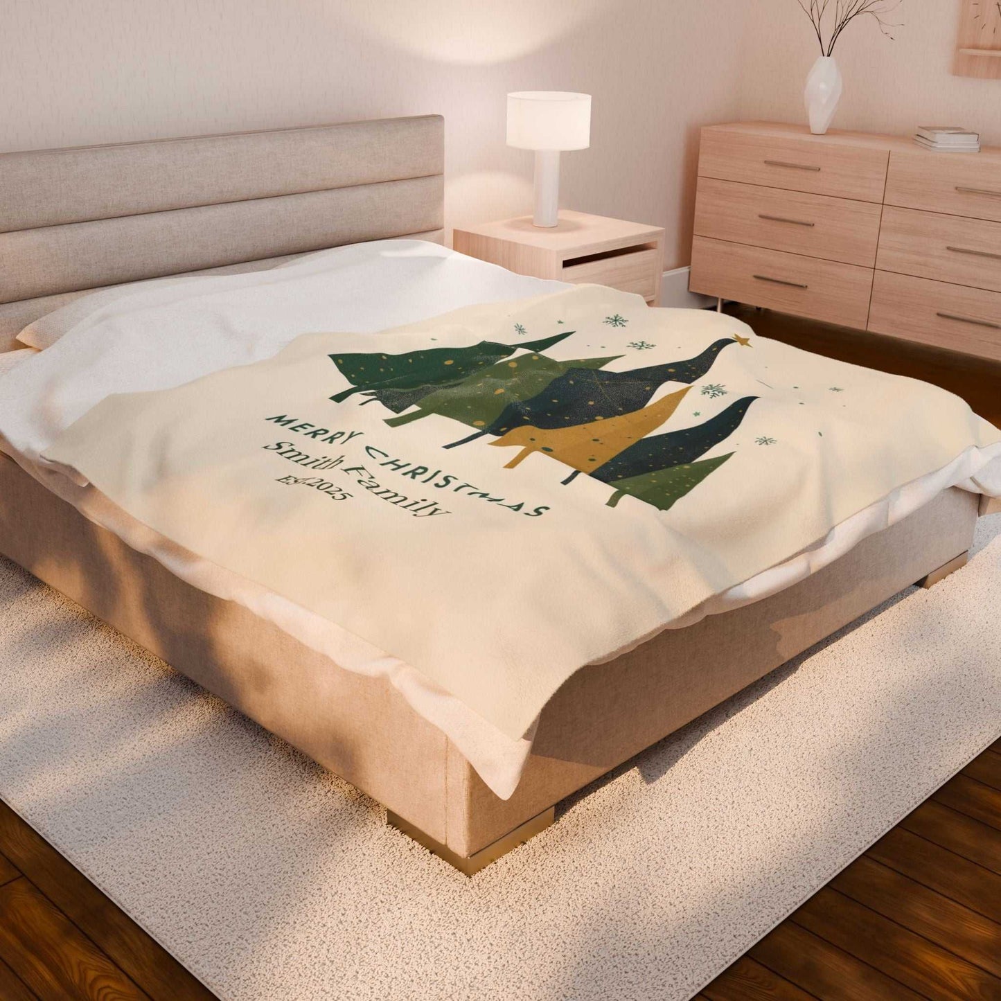 Personalized Christmas family tree fleece blanket with custom family name on bed in cozy bedroom setting