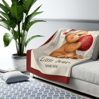 Personalized Mama Bear Christmas blanket with buffalo plaid border and custom family name, cozy holiday throw.