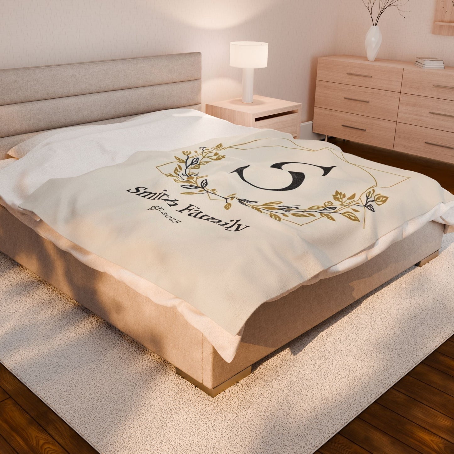 Personalized Family Monogram fleece blanket with custom names and elegant gold wreath design on a cozy bed throw for couples' anniversary or wedding gift