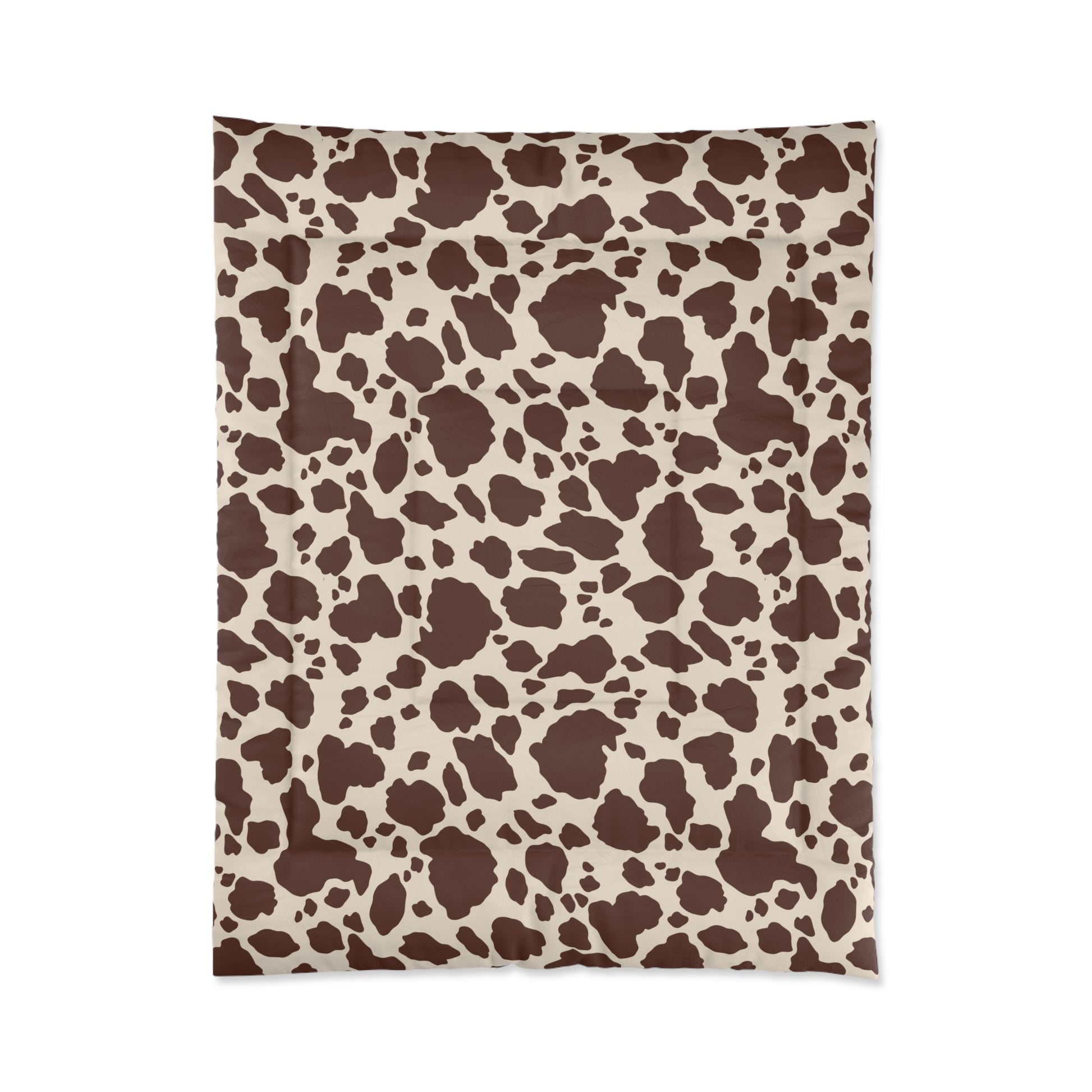 Cow Print Cozy Dorm Comforter in a soft aesthetic dorm room — soft natural lighting, warm layered styling by HomeStylesPlus