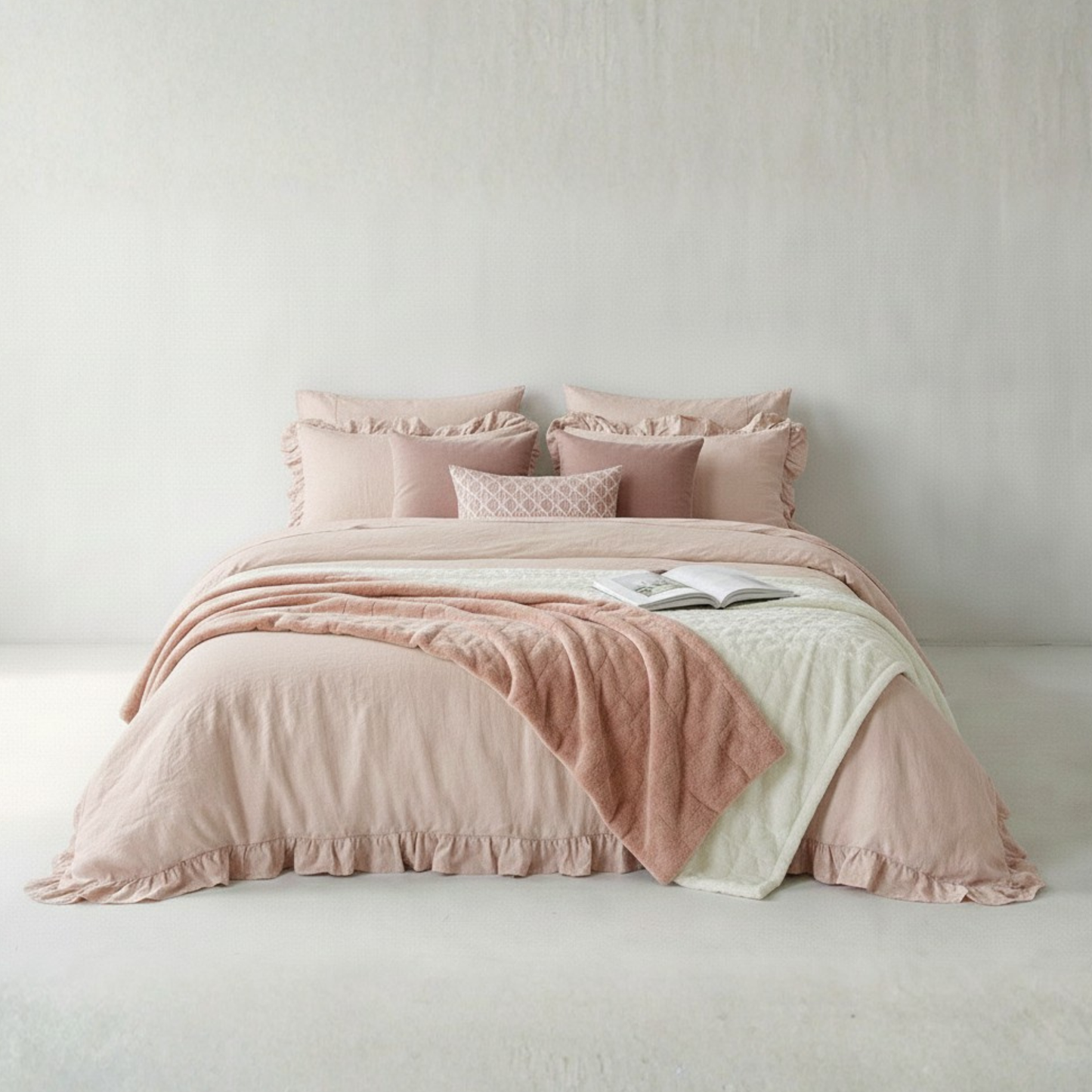 Blush pink rustic farmhouse ruffled duvet cover on bed with neutral decor