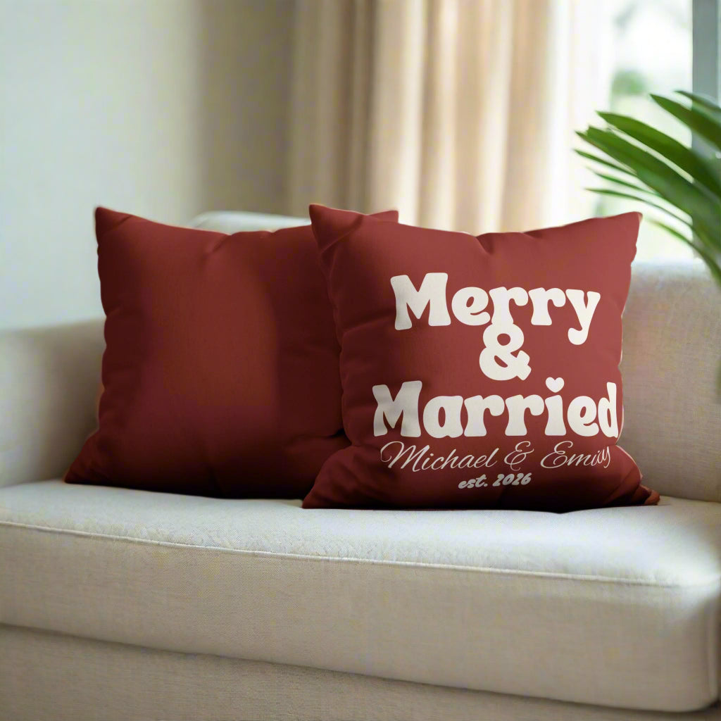 Red pillow with 'Merry & Married' text on a gray couch