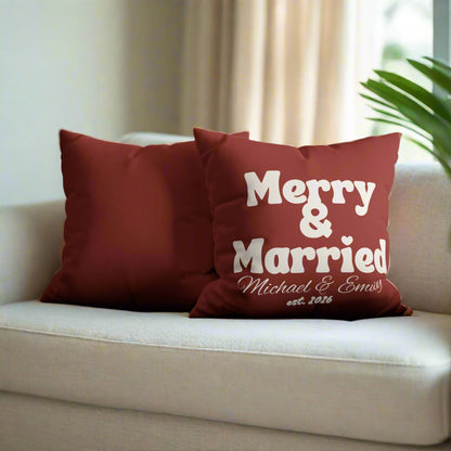 Red pillow with 'Merry & Married' text on a gray couch