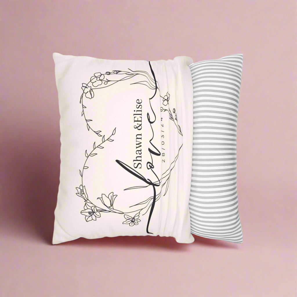Decorative pillow with artistic design and text on a white background