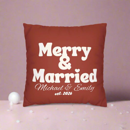 Red pillow with 'Merry & Married' text on a white background