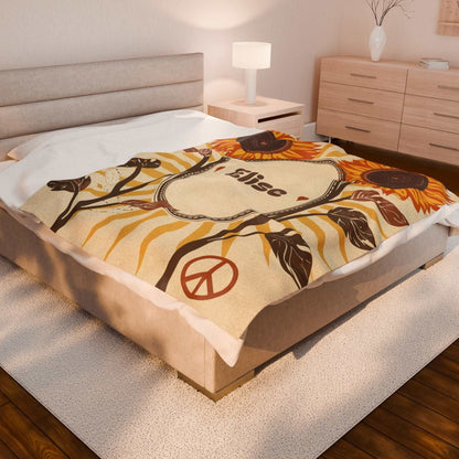 Personalized Velveteen Plush Blanket with sunflower and peace sign design on bed in cozy bedroom