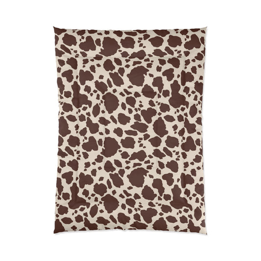 Cow Print Cozy Dorm Comforter in a soft aesthetic dorm room — soft natural lighting, warm layered styling by HomeStylesPlus
