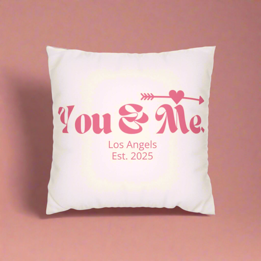 White pillow with pink text 'You & Me, Los Angeles Est. 2025' on a white background