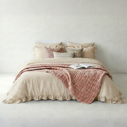 Beige rustic farmhouse bedroom with ruffled duvet cover and cozy decor