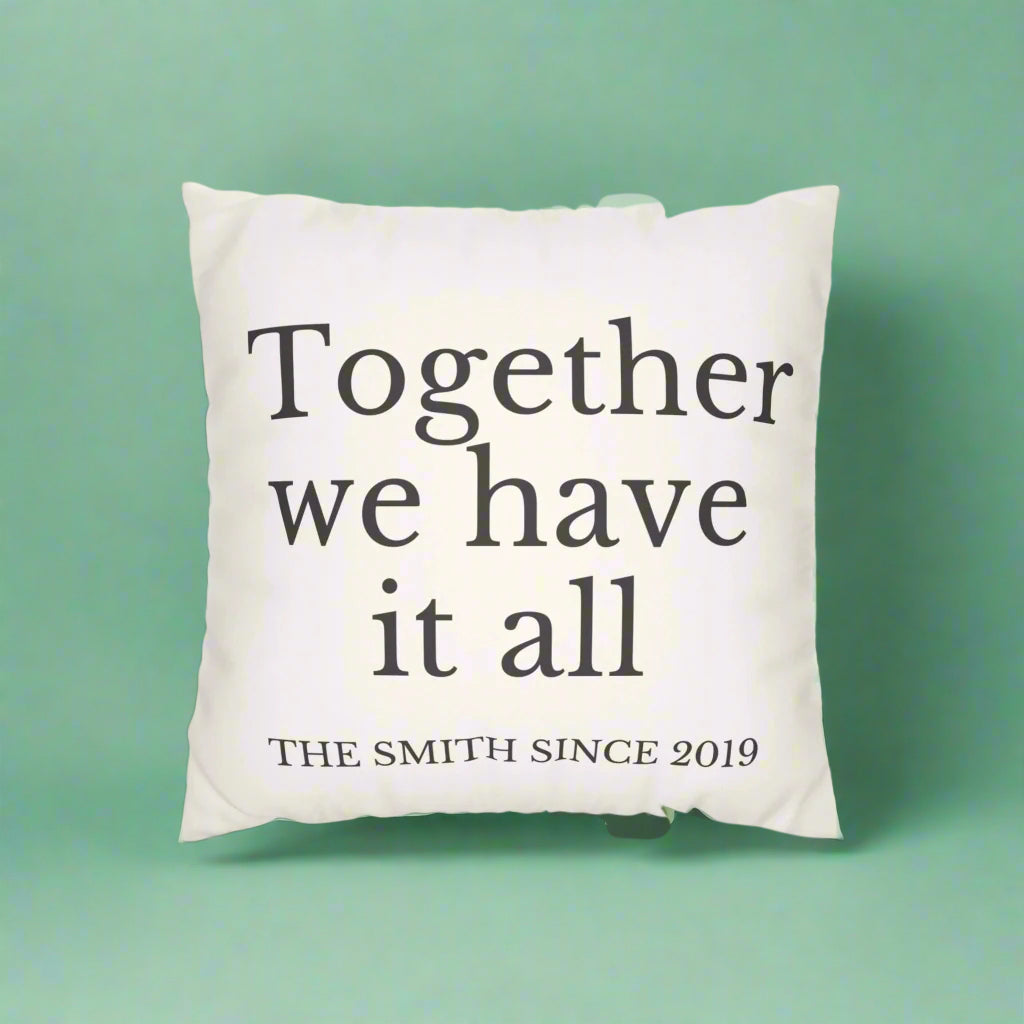 Decorative pillow with text and striped pillow on a white background