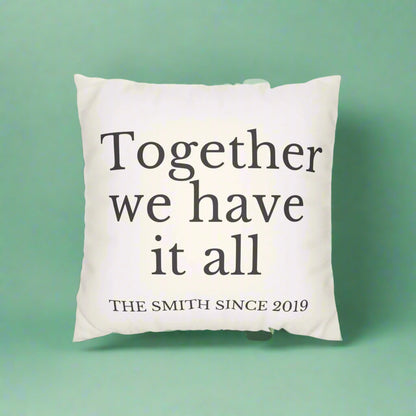 Decorative pillow with text and striped pillow on a white background