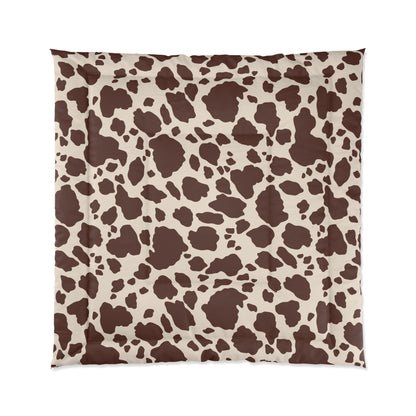 Cow Print Cozy Dorm Comforter in a soft aesthetic dorm room — soft natural lighting, warm layered styling by HomeStylesPlus