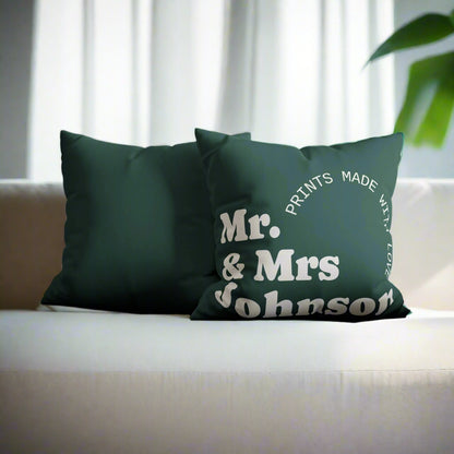 Green pillow with 'Mr. & Mrs. Johnson' text on a gray couch.