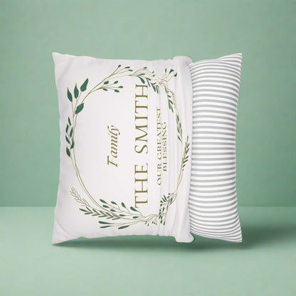 Decorative pillow with 'Family: The Smith, Our Greatest Blessing' text on a green background