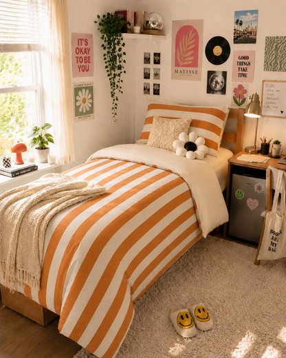 Orange white striped comforter on cozy Twin XL bed in modern nautical bedroom decor
