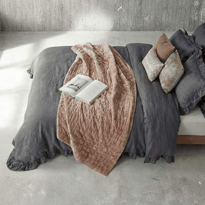 Dark grey rustic farmhouse ruffled duvet cover set on bed with cozy farmhouse decor