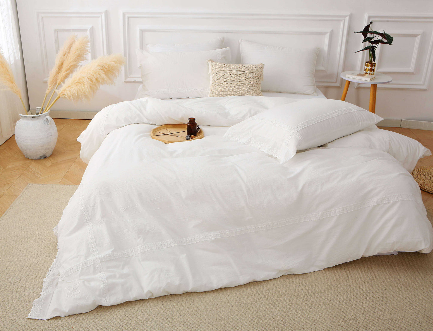 Modern farmhouse duvet cover with white lace trim in elegant bedroom setting.