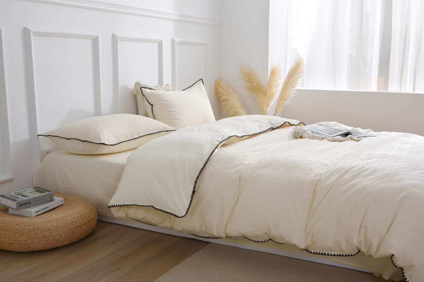 Cream white vintage duvet cover set in bedroom with soft pillows and elegant design.