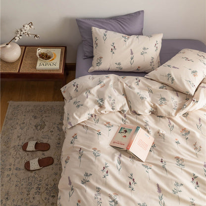Lavender botanical duvet set with soft cotton floral print bedding and matching pillowcases on a cozy bed
