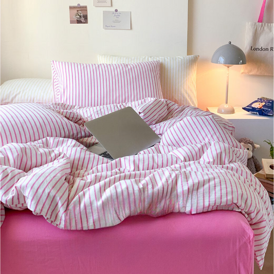 Dopamine decor bedroom with bright pink and yellow bee stripe bedding and neon accents