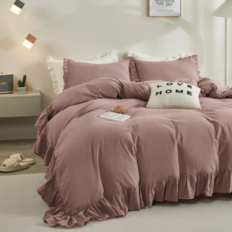 Rose Rustic Farmhouse ruffled duvet cover in dark grey on bed with accent pillows and décor.