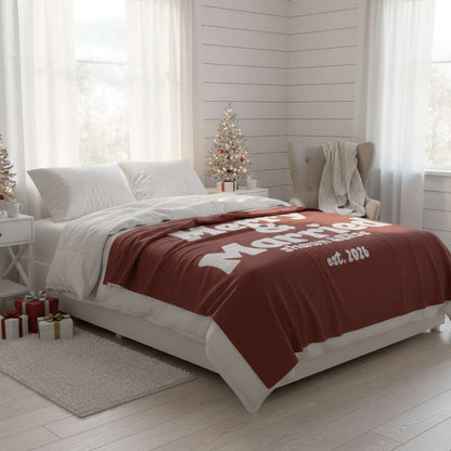 Personalized Christmas blanket in red with "Merry & Married" retro white text, custom couple names and year, perfect newlywed gift