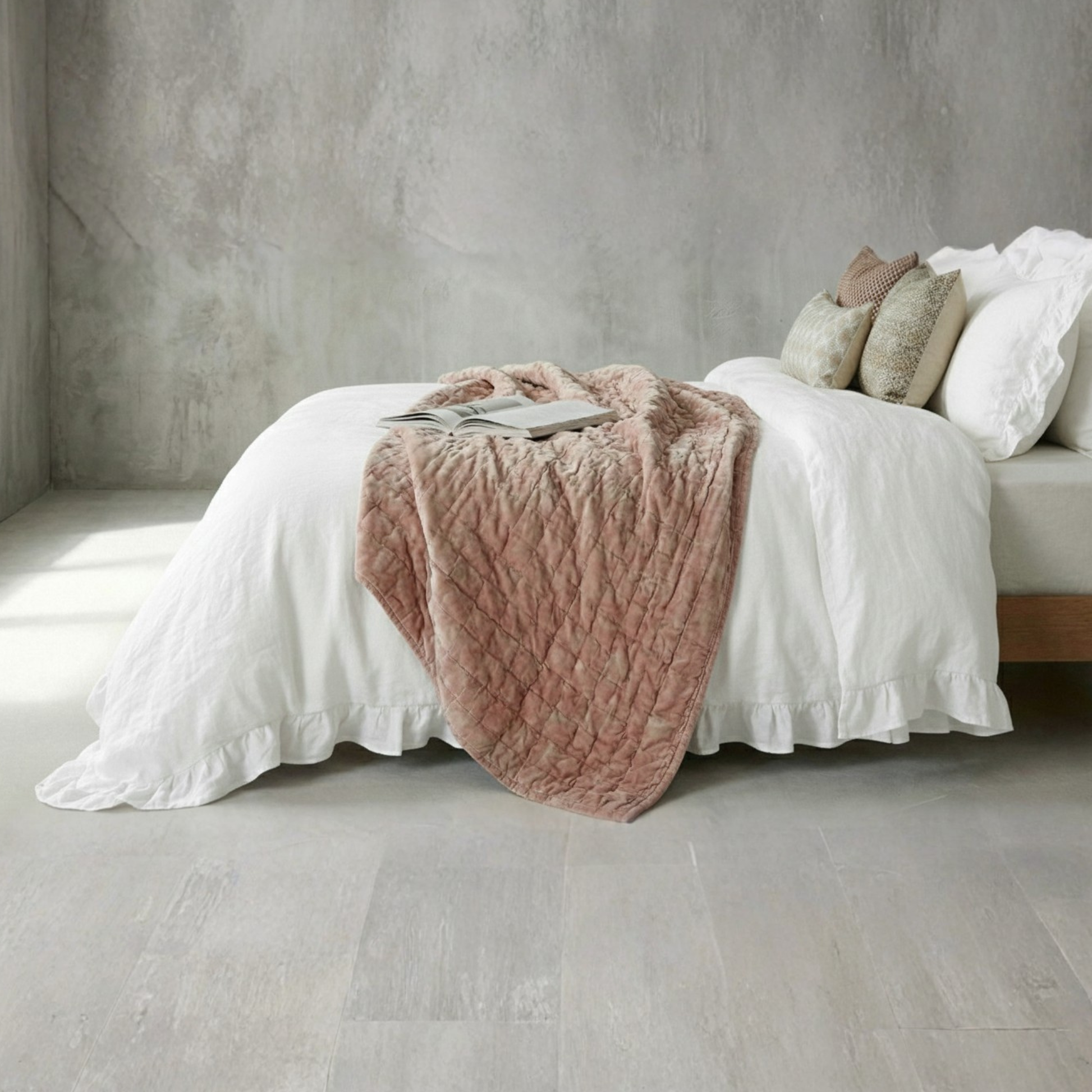 Minimalist white farmhouse bedroom decor with textured ruffled bedding