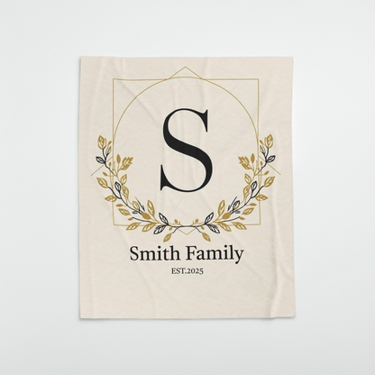 Personalized family monogram fleece blanket with elegant floral design and custom name, perfect wedding anniversary gift for couples